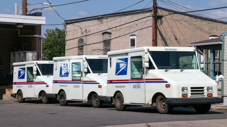 BALYKSU, DANVILLE, PENNSYLVANIA, UNITED STATES - 2022/07/20: Three United States Postal Service (USPS) mail trucks are parked in front of the post office in Danville. On July 20, the USPS announced that at least 40 percent of its Next Generation Delivery Vehicles (NGDVs) and commercial off-the-street (COTS) vehicles will be battery electric vehicles. (Photo by Paul Weaver/SOPA Images/LightRocket via Getty Images)