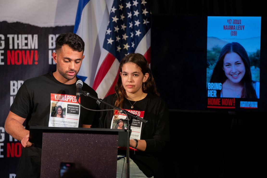 The siblings of Naama Levy, an Israeli hostage, speak  during a Lights for Liberty event demanding the release of the remaining 135 hostages held in Gaza, in Manhattan in New York City,  U.S. December 13, 2023. REUTERS/David Dee Delgado