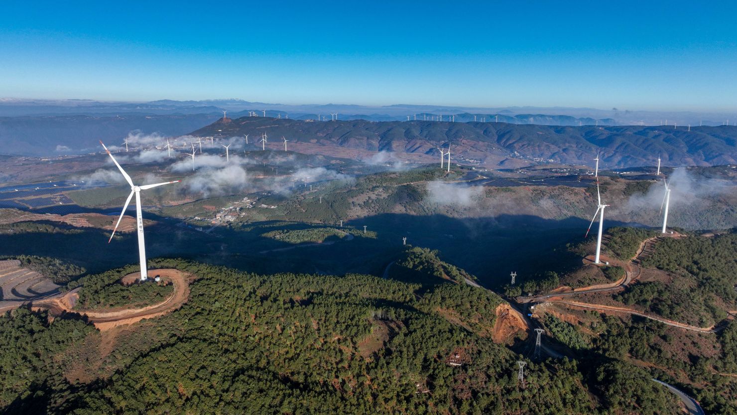 An aerial photo shows wind turbines generating electricity and solar photovoltaic panels generating electricity in Bijie City, Guizhou Province, China, November 19, 2023.