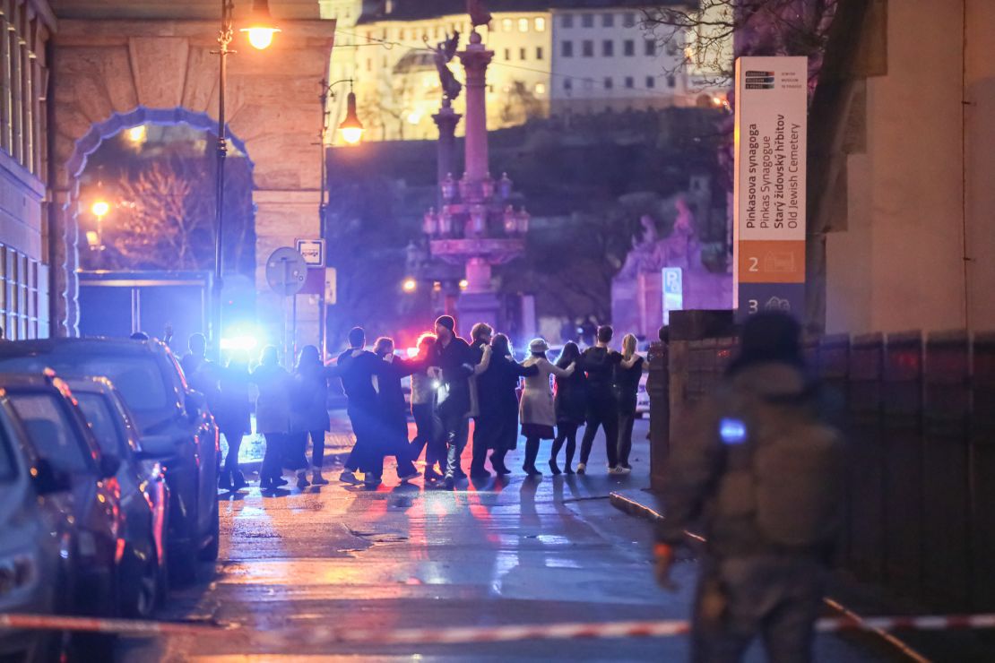 PRAGUE, CZECH REPUBLIC - DECEMBER 21: Students of Charles University are being evacuated by police at the location of the shooting on December 21, 2023 in Prague, Czech Republic. A shooting leaves several dead and dozens injured in university building in central Prague, with police confirming the gunman dead. (Photo by Gabriel Kuchta/Getty Images)