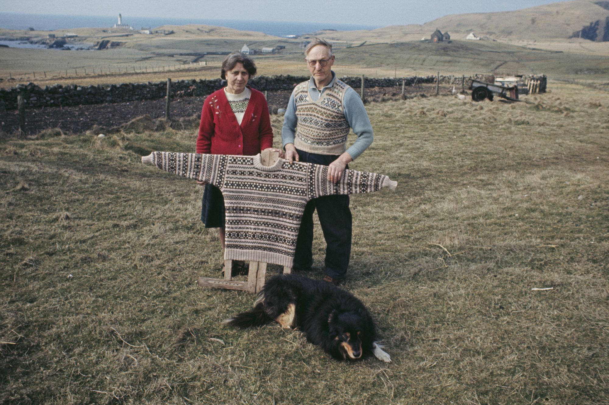 A couple with a traditional Fair Isle pattern sweater on a board, Fair Isle, Shetland Islands, Scotland, June 1970. (Photo by Chris Morphet/Redferns)