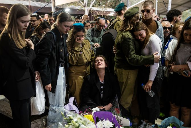 Family and friends react during the funeral for IDF Staff Sgt. Boris Dunavetski in Tel Aviv, Israel, on December 20.