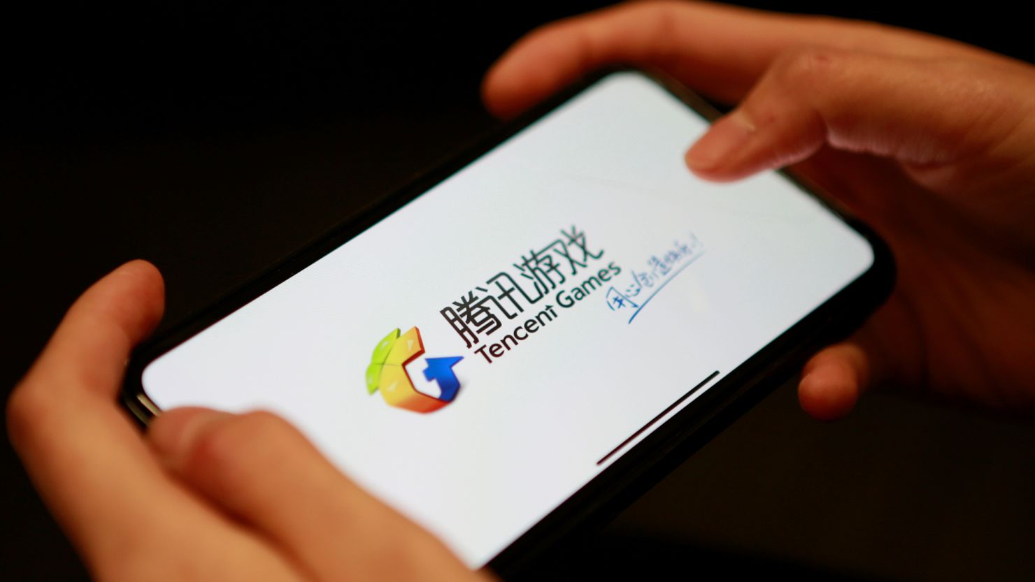 A Tencent Games logo from an app is seen on a mobile phone in this illustration picture taken November 5, 2018. REUTERS/Florence Lo/Illustration