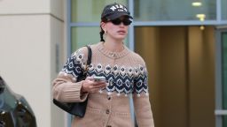 Hailey Bieber embraces festive fashion, donning a chic mini skirt while navigating Christmas shopping at Bottega Veneta on the trendy Melrose Ave in West Hollywood, effortlessly blending style and holiday spirit. 19 DECEMBER 2023.