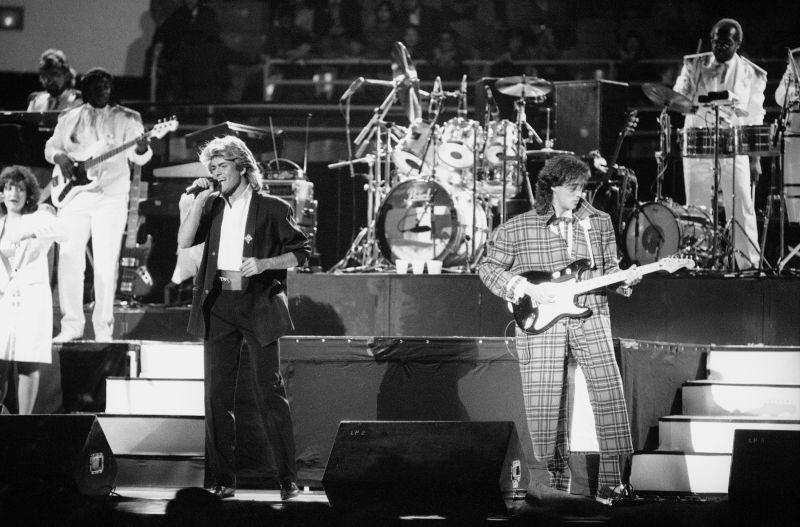 British pop duo Wham! performs on stage in Peking, April 7, 1985.