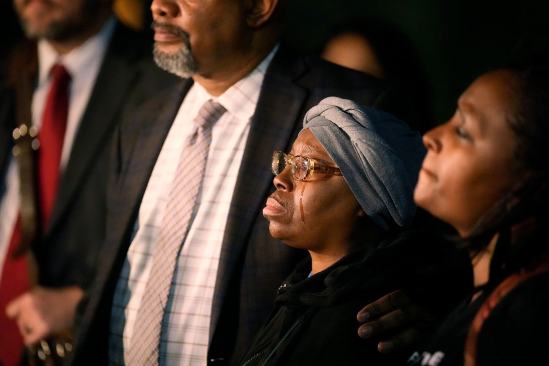 A tear runs down the cheek of Sheneen McClain as she is consoled by Omar Montgomery outside the Adams County Colo., Justice Center, after a verdict was rendered in the killing of her son Elijah McClain, Friday, Dec. 22, 2023, in Brighton, Colo. Two paramedics were convicted in the 2019 killing of McClain, who they injected with an overdose of the sedative ketamine after police put him in a neck hold. (AP Photo/David Zalubowski)