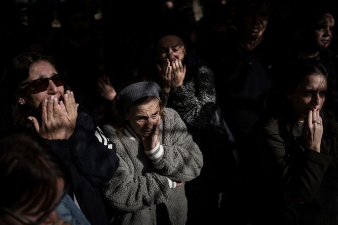 Mourners at the grave of Lt. Yaacov Elian mourn during his funeral at Kiryat Shaul cemetery in Tel Aviv, Israel, on December 22.