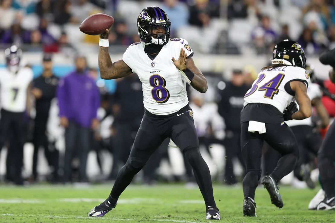 JACKSONVILLE, FLORIDA - DECEMBER 17: Lamar Jackson #8 of the Baltimore Ravens looks to pass the ball against the Jacksonville Jaguars during the third quarter at EverBank Stadium on December 17, 2023 in Jacksonville, Florida. (Photo by Mike Carlson/Getty Images)