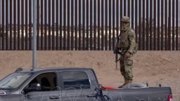 A member of the Texas National Guard is watching over the border between Mexico and the United States, aiming to prevent migrants from crossing on December 23, 2023.