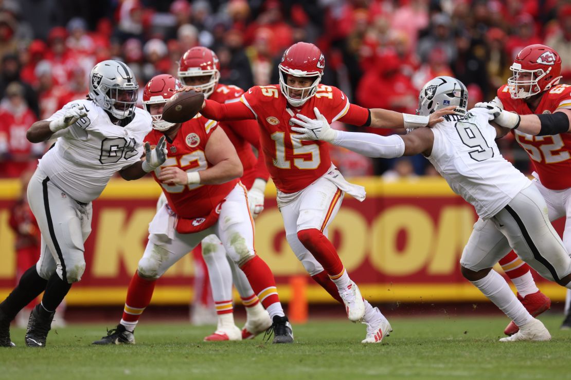 KANSAS CITY, MISSOURI - DECEMBER 25: Patrick Mahomes #15 of the Kansas City Chiefs runs with the ball during the third quarter against the Las Vegas Raiders at GEHA Field at Arrowhead Stadium on December 25, 2023 in Kansas City, Missouri. (Photo by Jamie Squire/Getty Images)