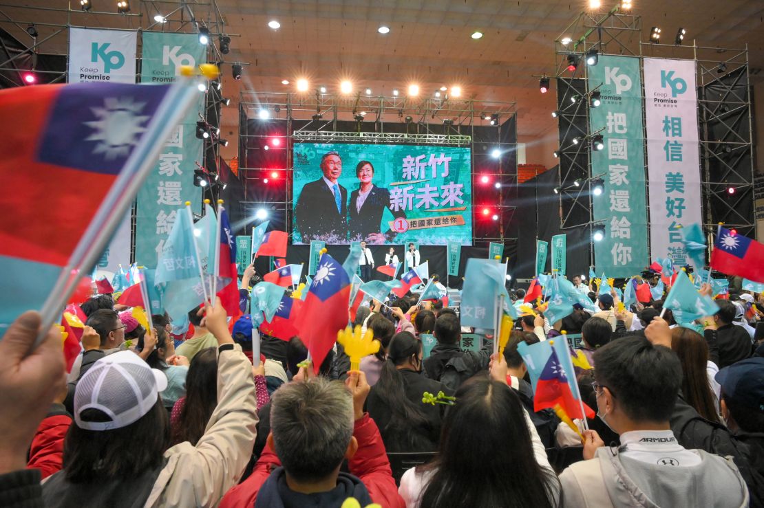 Supporters of Ko Wen-je, the presidential candidate from the Taiwan People's Party (TPP), wave flags during a campaign rally in Hsinchu on December 23, 2023.