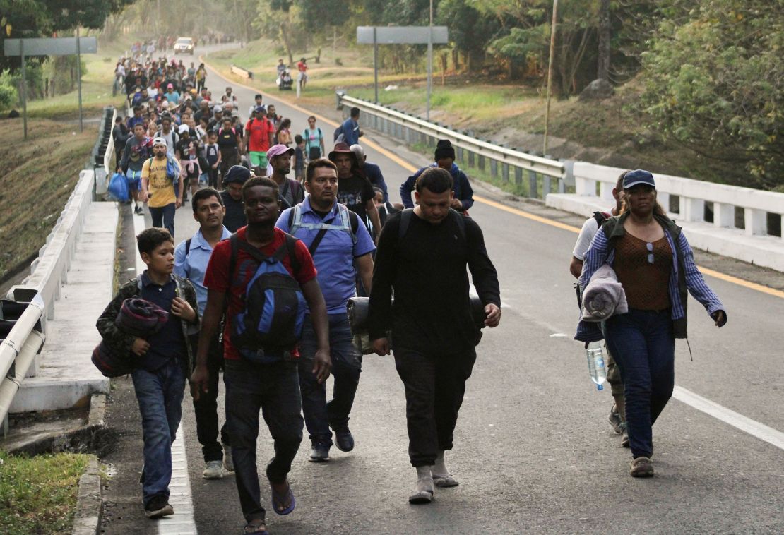 Migrants walk in a caravan in an attempt to reach the U.S. border, in Escuintla, Mexico December 27, 2023. REUTERS/Jose Torres