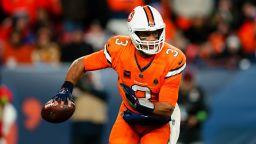 DENVER, CO - DECEMBER 24:  Quarterback Russell Wilson #3 of the Denver Broncos scrambles out of the pocket during the third quarter against the New England Patriots at Empower Field at Mile High on December 24, 2023 in Denver, Colorado. (Photo by Justin Edmonds/Getty Images)