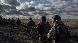 Ukrainian servicemen of the 55th Separate Artillery Brigade walk at a position near the front line town of Marinka, amid Russia's attack on Ukraine, in Donetsk region, Ukraine December 26, 2023. REUTERS/Viacheslav Ratynskyi