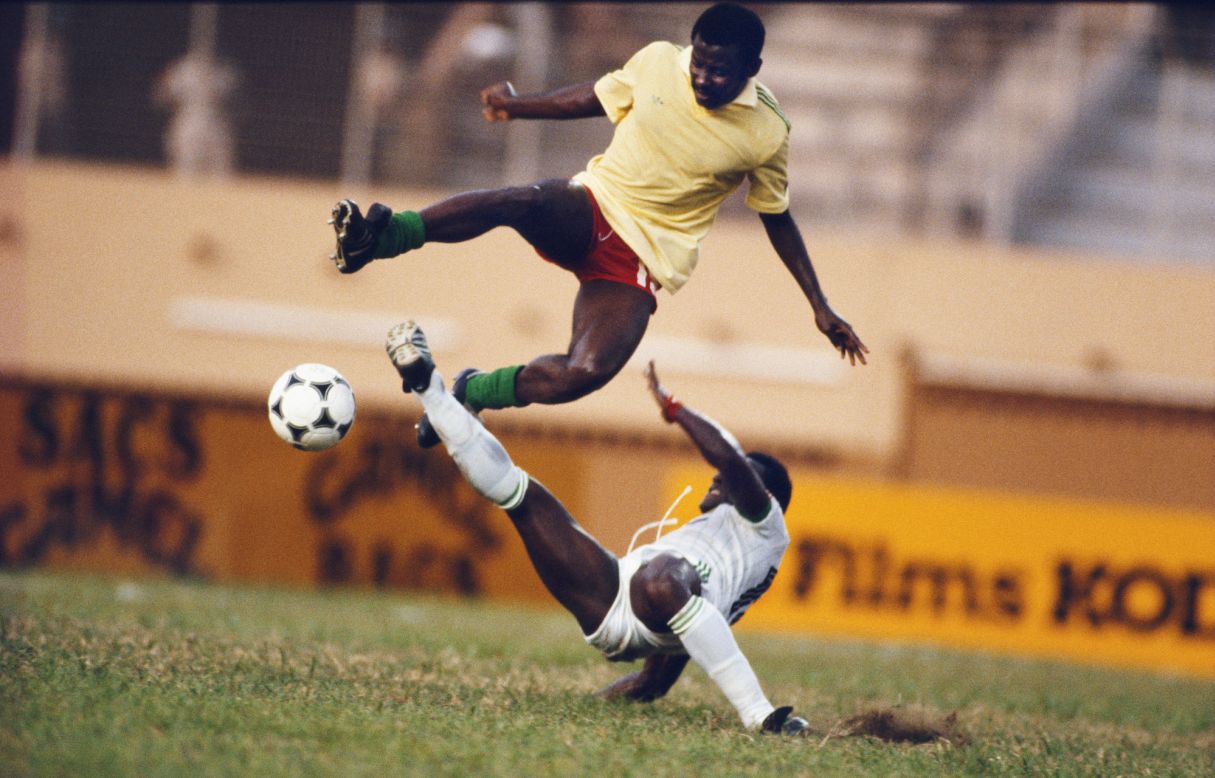 Cameroon's Francois N'doumbe hurdles a robust challenge from Pascal Miezen, midfielder for competition hosts Ivory Coast in 1984. N'doumbe and the Indomitable Lions lived up to their nickname at the tournament, condemning the hosts to a group stage exit before going on to beat Nigeria 3-1 in the final to claim the first of their five AFCON crowns.