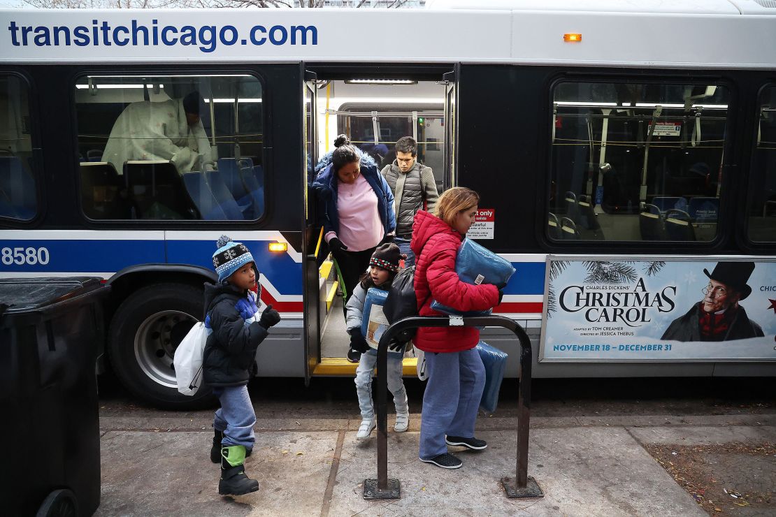 Large numbers of migrants have been cleared out of several Chicago police stations in recent days, including the 1st District station where a new group of migrants arrives Nov. 20, 2023. (Terrence Antonio James/Chicago Tribune/Tribune News Service via Getty Images)