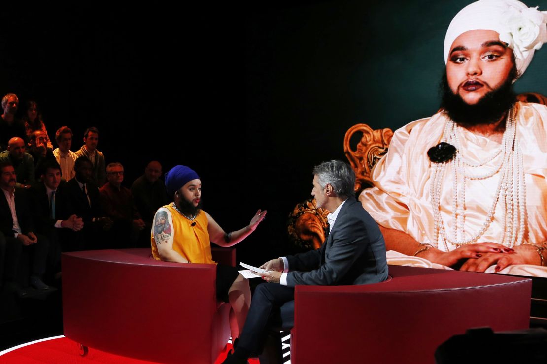 French TV host Antoine de Caunes (R) talks with British Harnaam Kaur, known to have excess facial hair (C), during the show "L'Emission d'Antoine" on the set of the French TV channel Canal+ on October 29, 2015 in Paris. After the "Grand Journal"', Antoines de Caunes hosts a new show which broadcast will start on November 6. AFP PHOTO / THOMAS SAMSON        (Photo credit should read THOMAS SAMSON/AFP via Getty Images)
