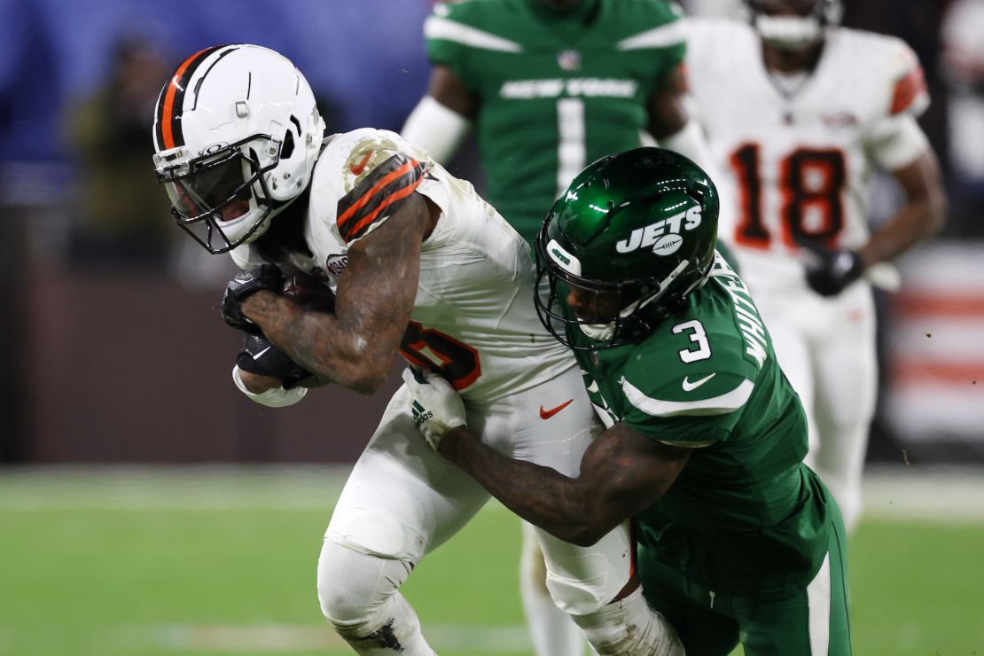 CLEVELAND, OHIO - DECEMBER 28: Elijah Moore #8 of the Cleveland Browns is tackled by Jordan Whitehead #3 of the New York Jets at Cleveland Browns Stadium on December 28, 2023 in Cleveland, Ohio. (Photo by Gregory Shamus/Getty Images)