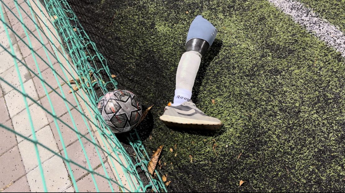 A prothesis lies by the side of the pitch where the amputees play.