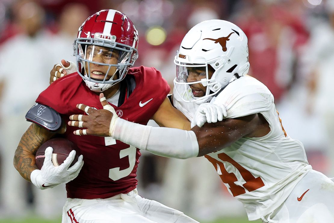 TUSCALOOSA, AL - SEPTEMBER 09: Jermaine Burton #3 of the Alabama Crimson Tide avoids a tackle by Jaylan Ford #41 of the Texas Longhorns during the third quarter at Bryant-Denny Stadium on September 09, 2023 in Tuscaloosa, Alabama.  (Photo by Kevin C. Cox/Getty Images)