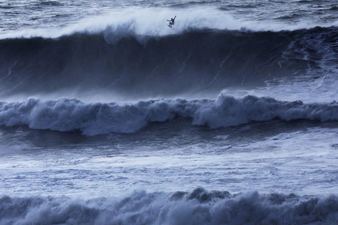 A surfer catches some air off a wave at Mavericks Beach near Half Moon Bay, California, U.S., December 28, 2023. REUTERS/Nathan Frandino     TPX IMAGES OF THE DAY