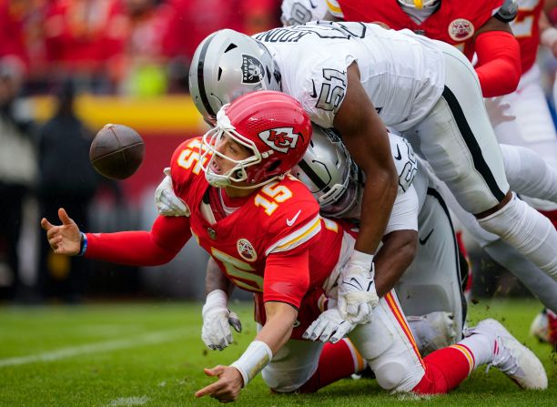 Kansas City Chiefs quarterback Patrick Mahomes recovers his fumble as he is hit during the <a href="https://www.cnn.com/2023/12/27/sport/kansas-city-chiefs-las-vegas-raiders-spt-intl/index.html" target="_blank">Chiefs' disappointing 20-14 loss</a> to the Las Vegas Raiders on December 25. The loss ensured the Chiefs cannot earn the No.1 seed in the AFC and postponed the sealing of their eighth consecutive AFC West title, as they fell to 9-6.