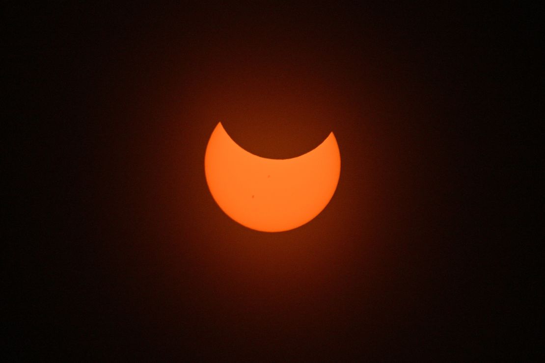 ALBUQUERQUE, NEW MEXICO - OCTOBER 14:  The moon crosses in front of the sun during the Annular Solar Eclipse on October 14, 2023 in Albuquerque, New Mexico.  Differing from a total solar eclipse, the moon in an annular solar eclipse appears too small to cover the sun completely, creating a "ring of fire" effect around the moon.  (Photo by Sam Wasson/Getty Images)