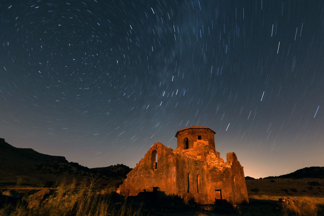 AKSARAY, TURKIYE - AUGUST 12: A long exposure photo shows Perseid meteor shower over Red Church and Guzelyurt Monastery Valley in Guzelyurt district of Aksaray, Turkiye on August 12, 2023. (Photo by Aytug Can Sencar/Anadolu Agency via Getty Images)