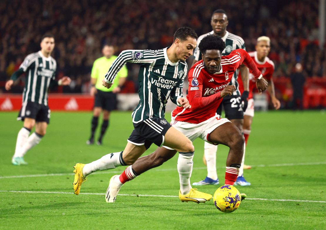 Soccer Football - Premier League - Nottingham Forest v Manchester United - The City Ground, Nottingham, Britain - December 30, 2023 Nottingham Forest's Ola Aina in action with Manchester United's Antony