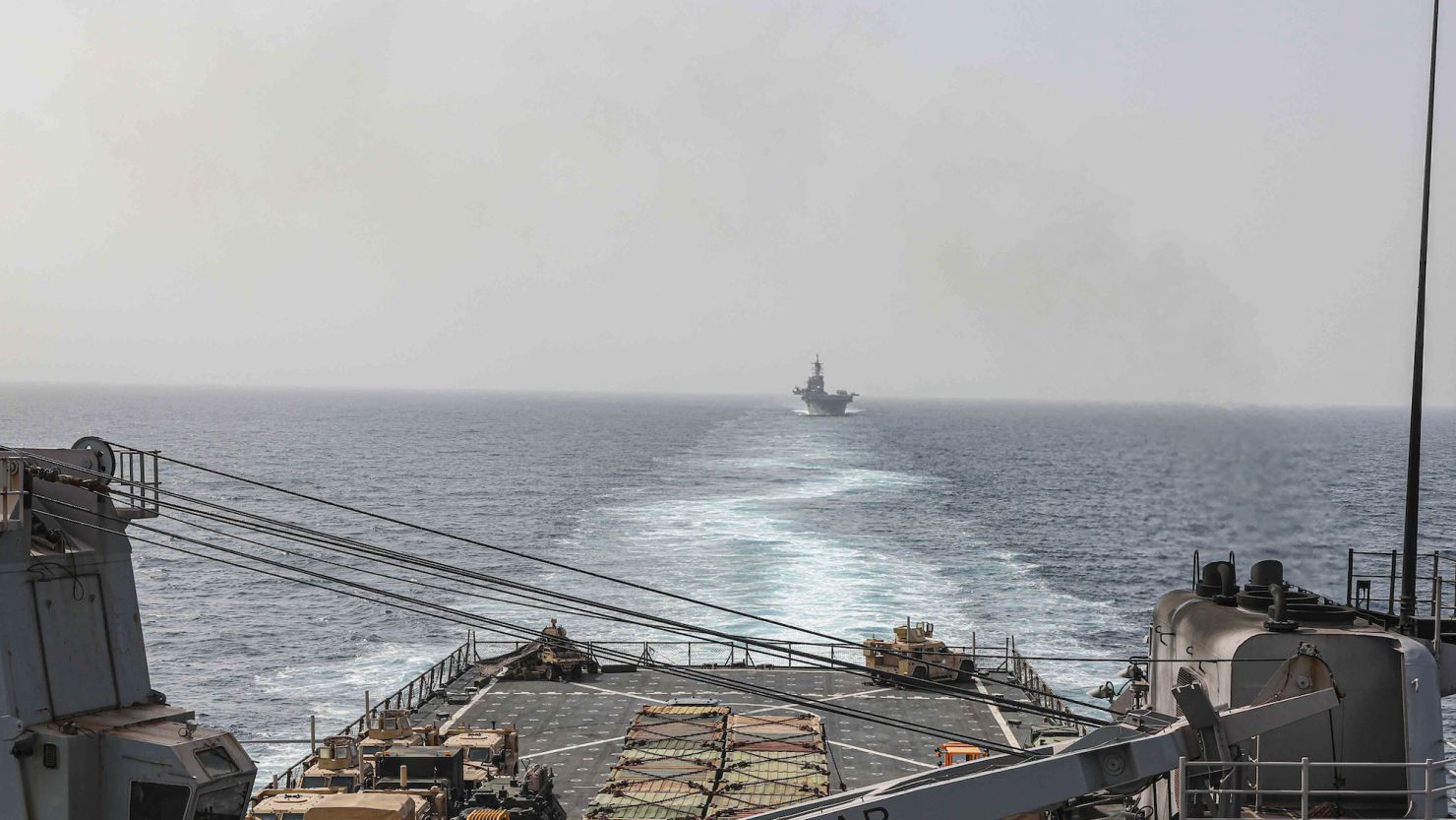 In this image provided by the U.S. Navy, the amphibious dock landing ship USS Carter Hall and amphibious assault ship USS Bataan transit the Bab al-Mandeb strait on Aug. 9, 2023.  The top commander of U.S. naval forces in the Middle East says Yemen's Houthi rebels are showing no signs of ending their "reckless" attacks on commercial ships in the Red Sea. But Vice Adm. Brad Cooper said in an Associated Press interview on Saturday that more nations are joining the international maritime mission to protect vessels in the vital waterway and trade traffic is beginning to pick up. (Mass Communications Spc. 2nd Class Moises Sandoval/U.S. Navy via AP)