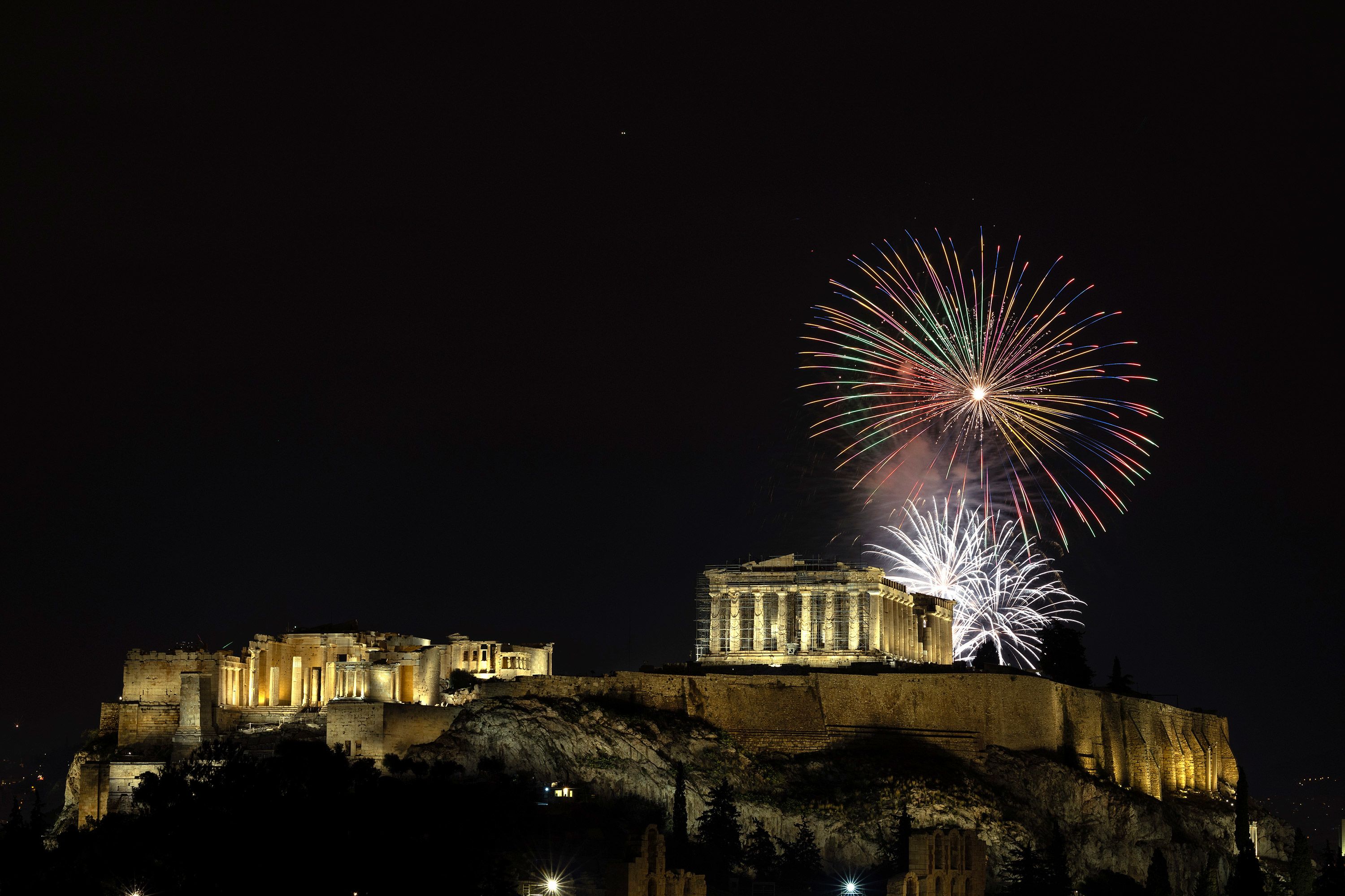 Fireworks explode over the ancient Parthenon temple in Athens, Greece.