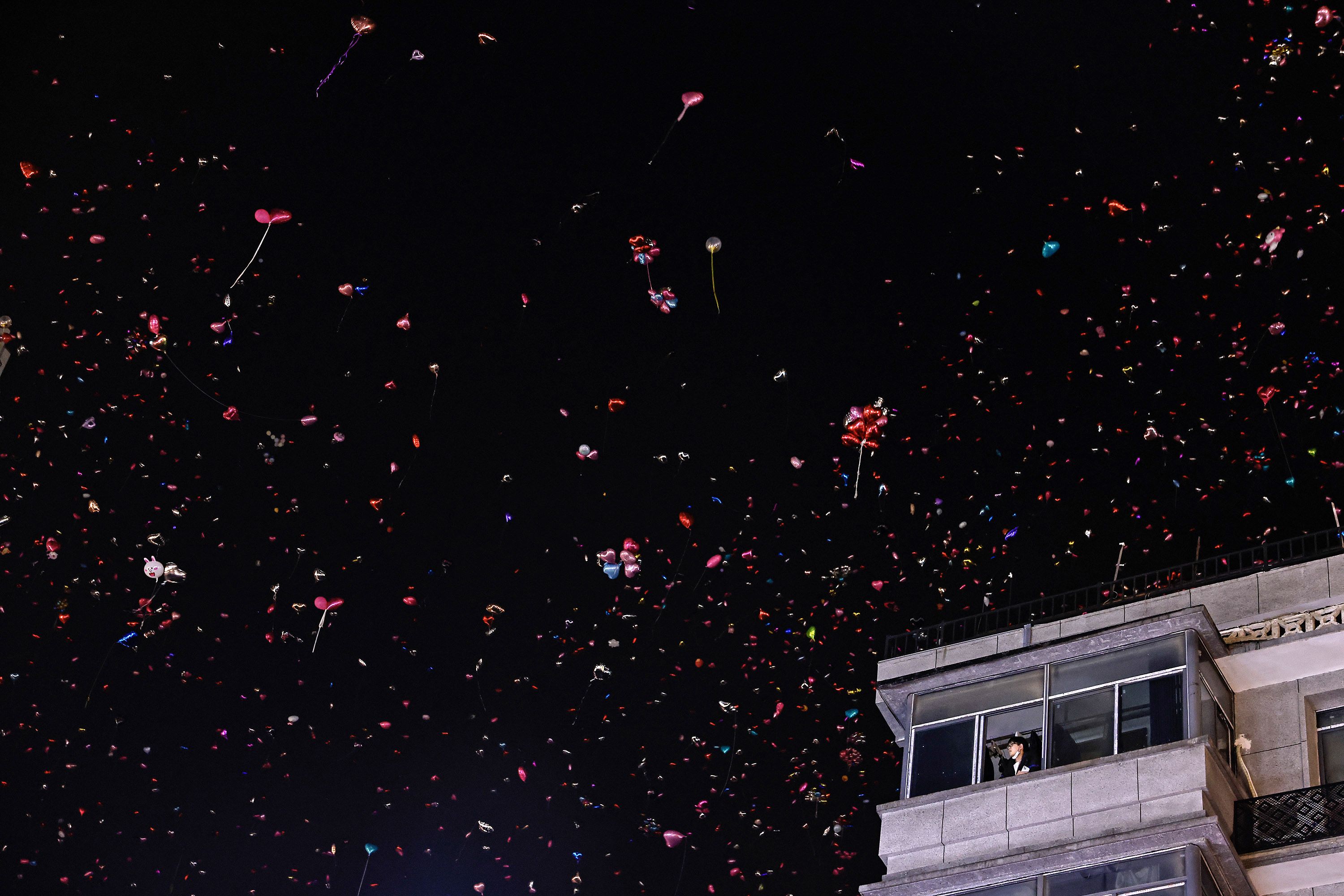 People release balloons into the air in Wuhan, China.