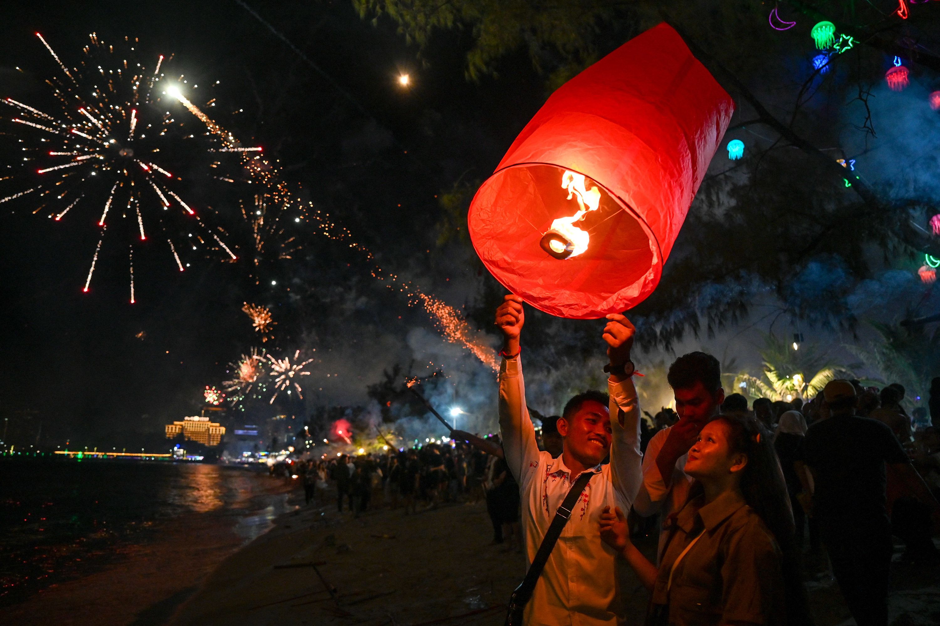 People release a lantern at a beach in Sihanoukville, the coastal capital of Preah Sihanouk in Cambodia.