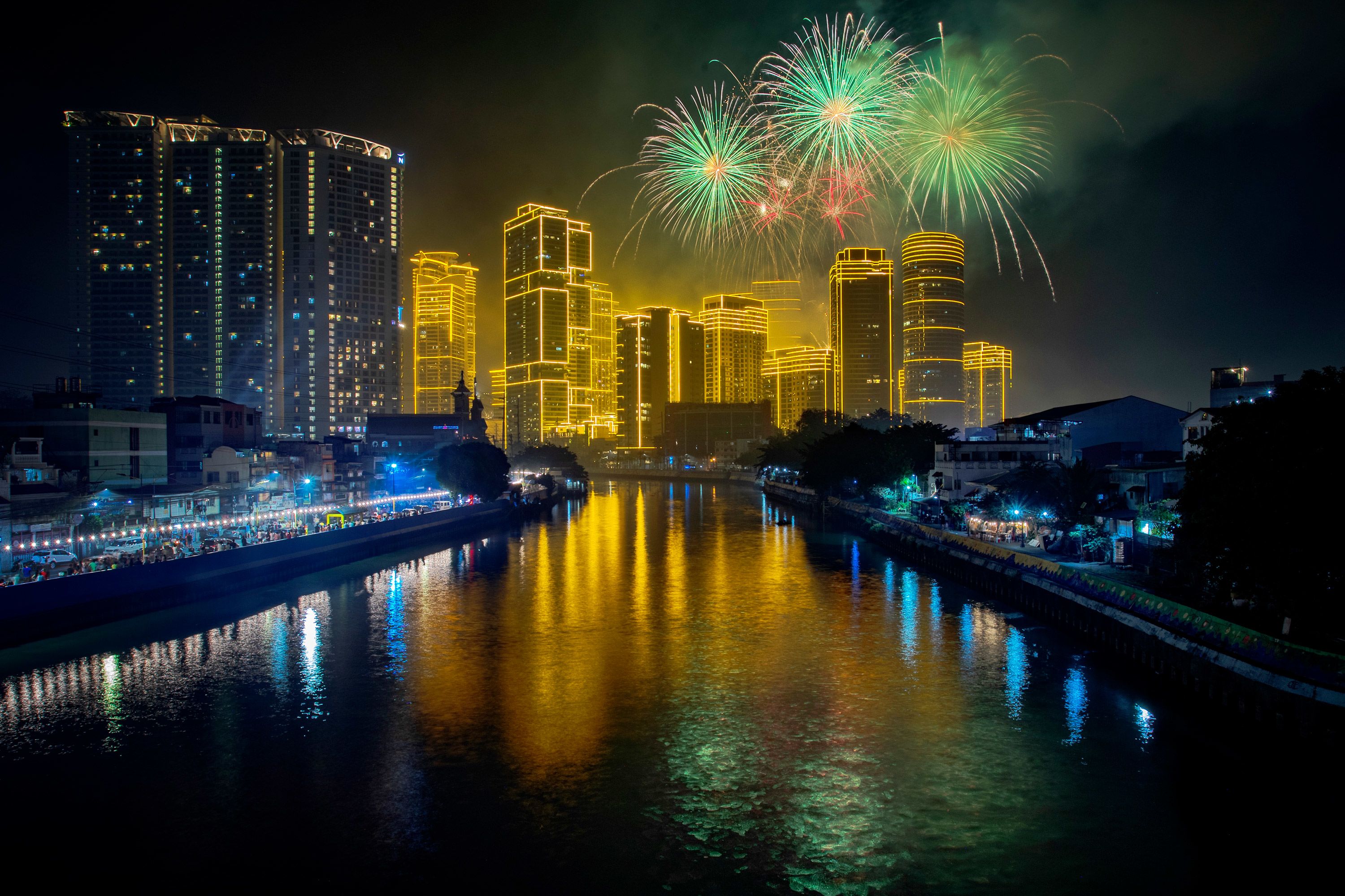 Fireworks explode over skyscrapers in Makati, a city in the Philippines' Metro Manila region.