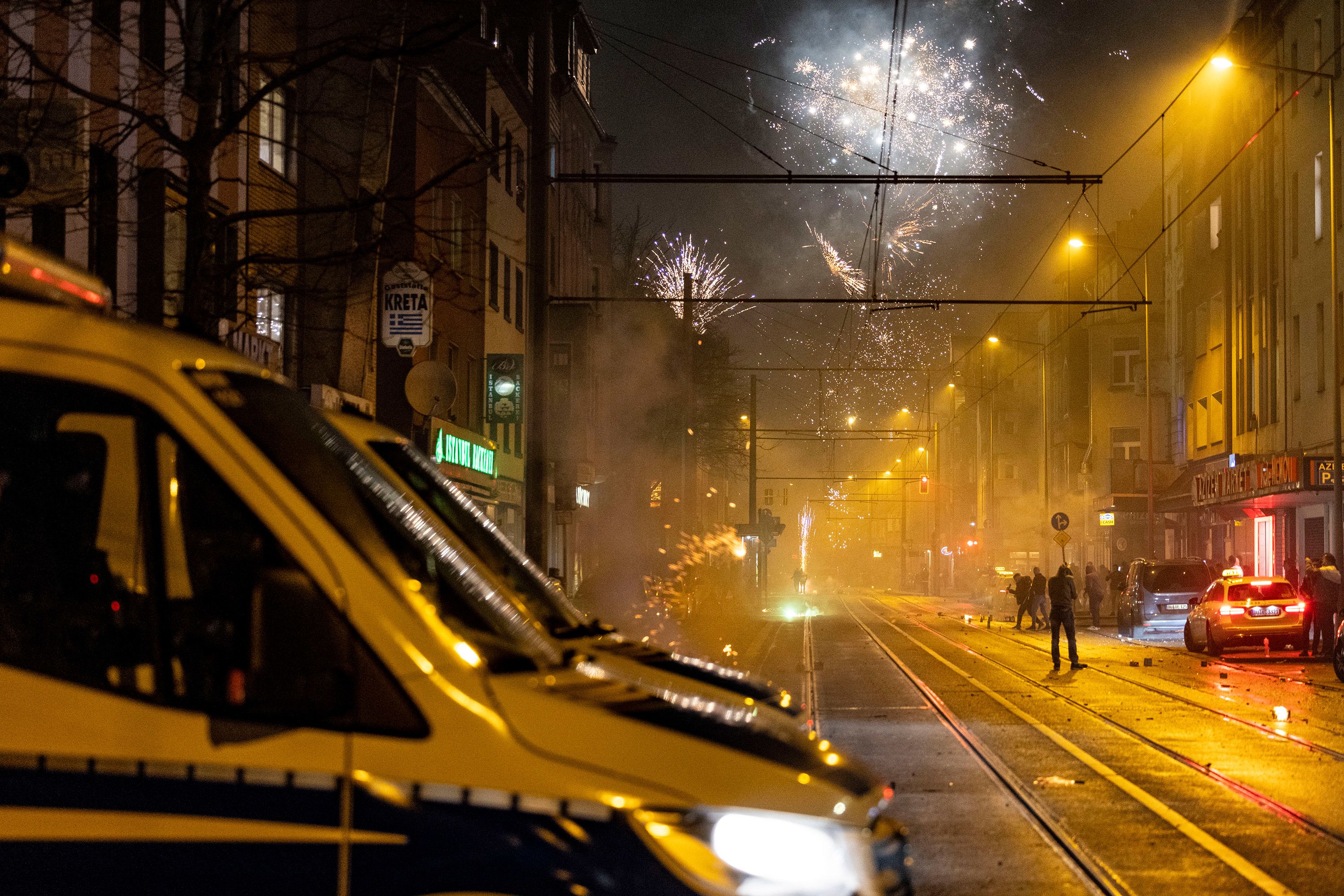 Police standby as fireworks are set off in Duisburg, Germany.