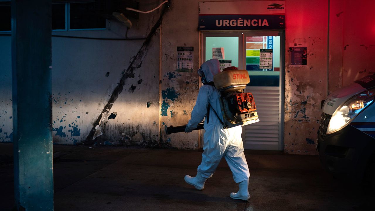 A worker sprays disinfectant to help contain the spread of the coronavirus outside a hospital in Manacapuru, Amazonas state, Brazil on June 2.