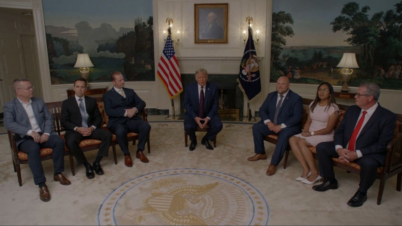 President Trump sits with former hostages and detainees who were freed during his administration.