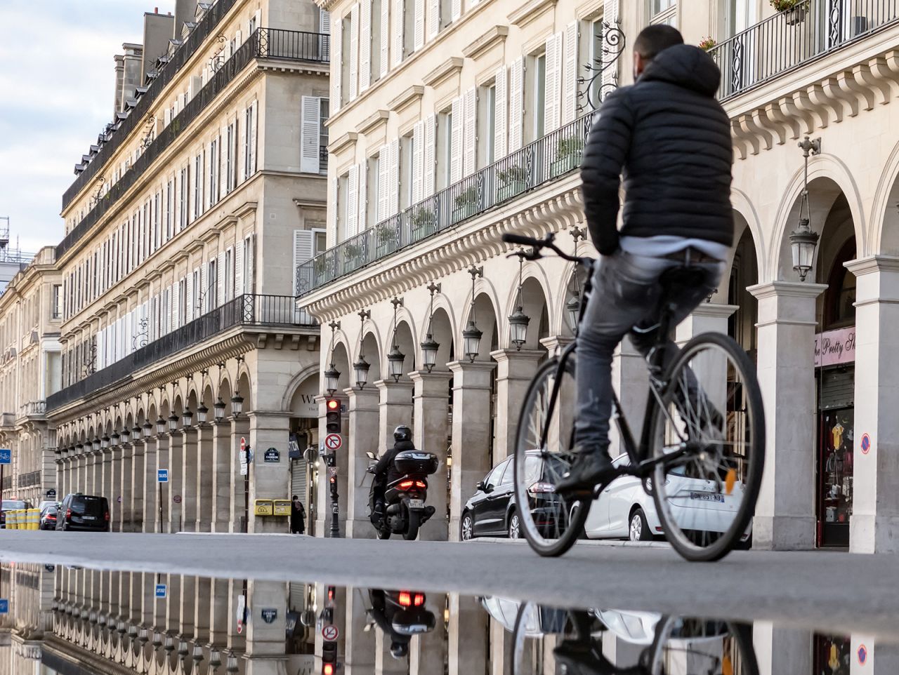 A cyclist rides on the Rue de Rivoli in Paris on November 23. 