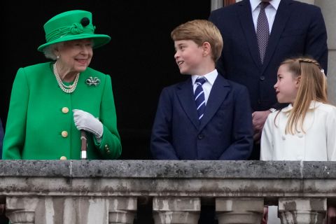 Queen Elizabeth II, Prince George and Princess Charlotte stand on the balcony of Buckingham Palace in London on June 05.