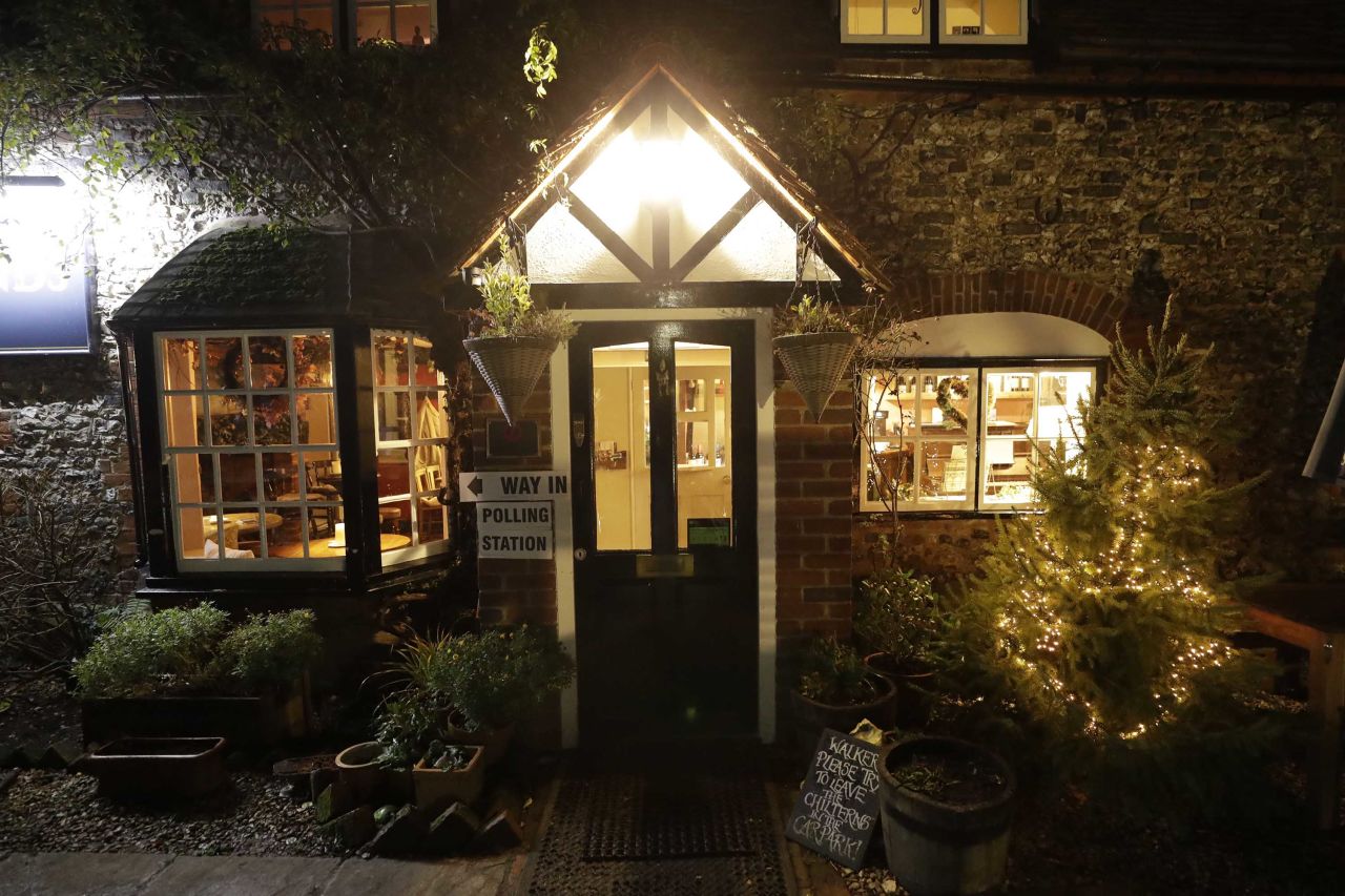 A Christmas tree is seen outside a polling station at the Fox & Hounds pub in the hamlet of Christmas Common, in Oxfordshire, England. Photo: Matt Dunham/AP