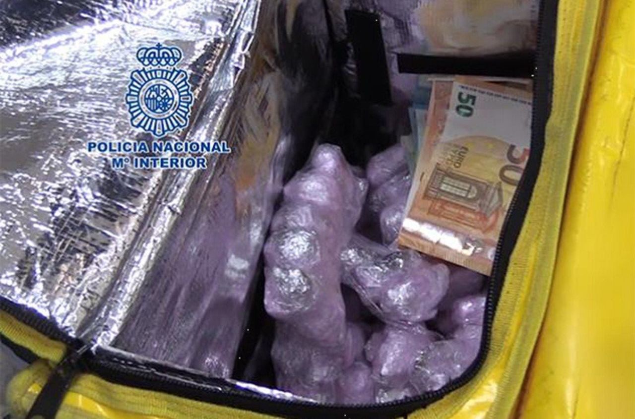 Police in Spain released images showing?drugs that were concealed in the false bottom of a food delivery backpack, an Interpol report said.