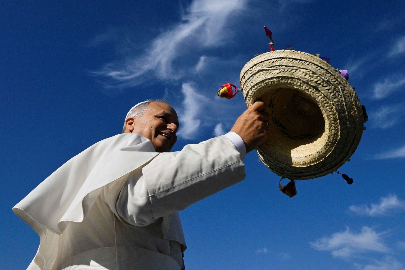 Pope Leo XIV holds a hat on the day of Mass at the <a href="index.php?page=&url=https%3A%2F%2Fwww.cnn.com%2F2025%2F08%2F03%2Feurope%2Fpope-leo-gen-z-rome-festival-intl">Jubilee of Youth</a> festival in Rome, Italy, on Sunday, August 3. Hundreds of thousands of young people descended on the Eternal City throughout the week for a festival of faith, music and religious services that saw groups of teens and young adults from across the globe singing songs, waving flags on Rome’s ancient streets and camping out in huge warehouses on the city’s outskirts.