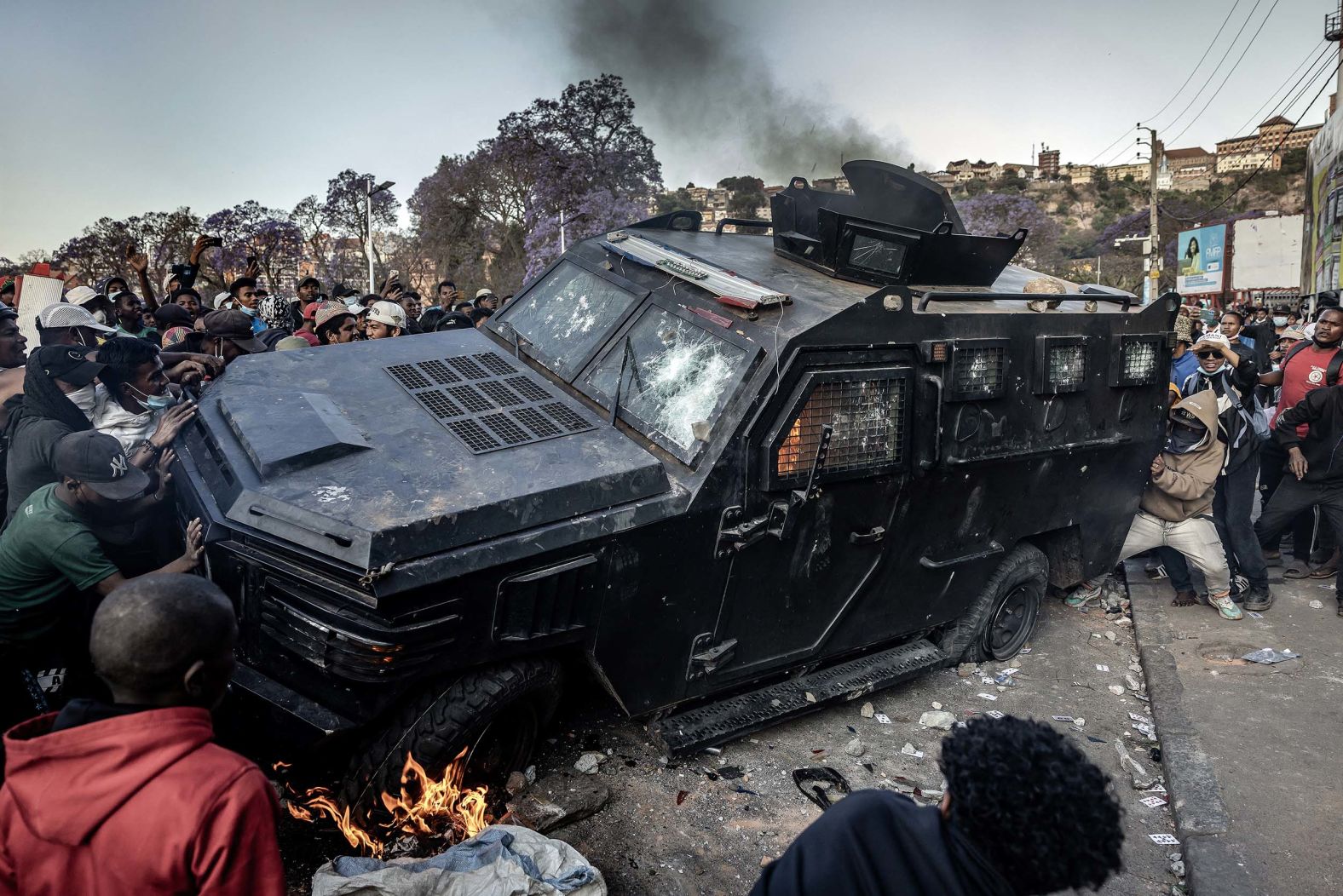 Protesters vandalize an armored vehicle during clashes with security forces in Antananarivo, Madagascar, on Saturday, October 11. <a href="index.php?page=&url=https%3A%2F%2Fwww.cnn.com%2F2025%2F10%2F13%2Fworld%2Fmadagascar-president-leaves-country-gen-z-protests-intl">Madagascar’s president fled the African nation</a>, the head of the opposition and other officials said on Monday, following weeks of youth-led protests. Demonstrations began last month over water and power shortages but quickly escalated into an uprising over broader grievances, including corruption, bad governance and lack of basic services.