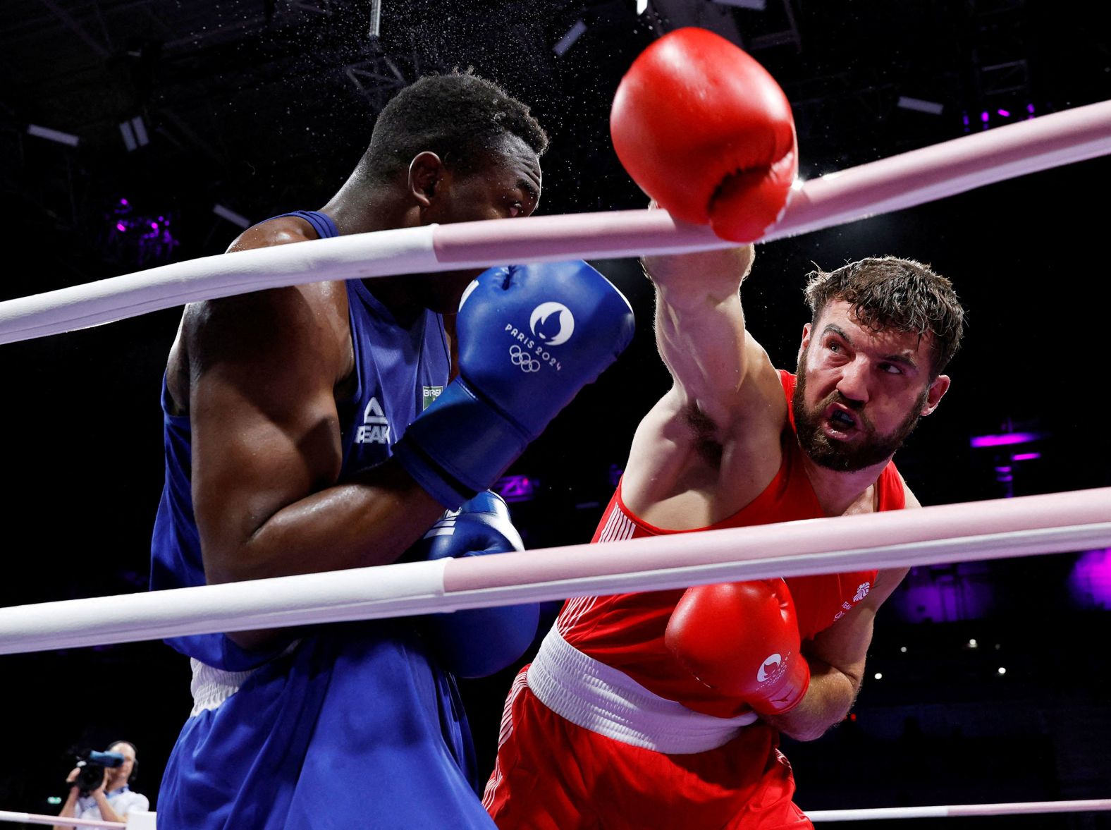 Great Britain's Patrick James Brown swings at Brazil's Keno Marley Machado during an Olympic heavyweight bout on Sunday, July 28. Machado won 4-1.
