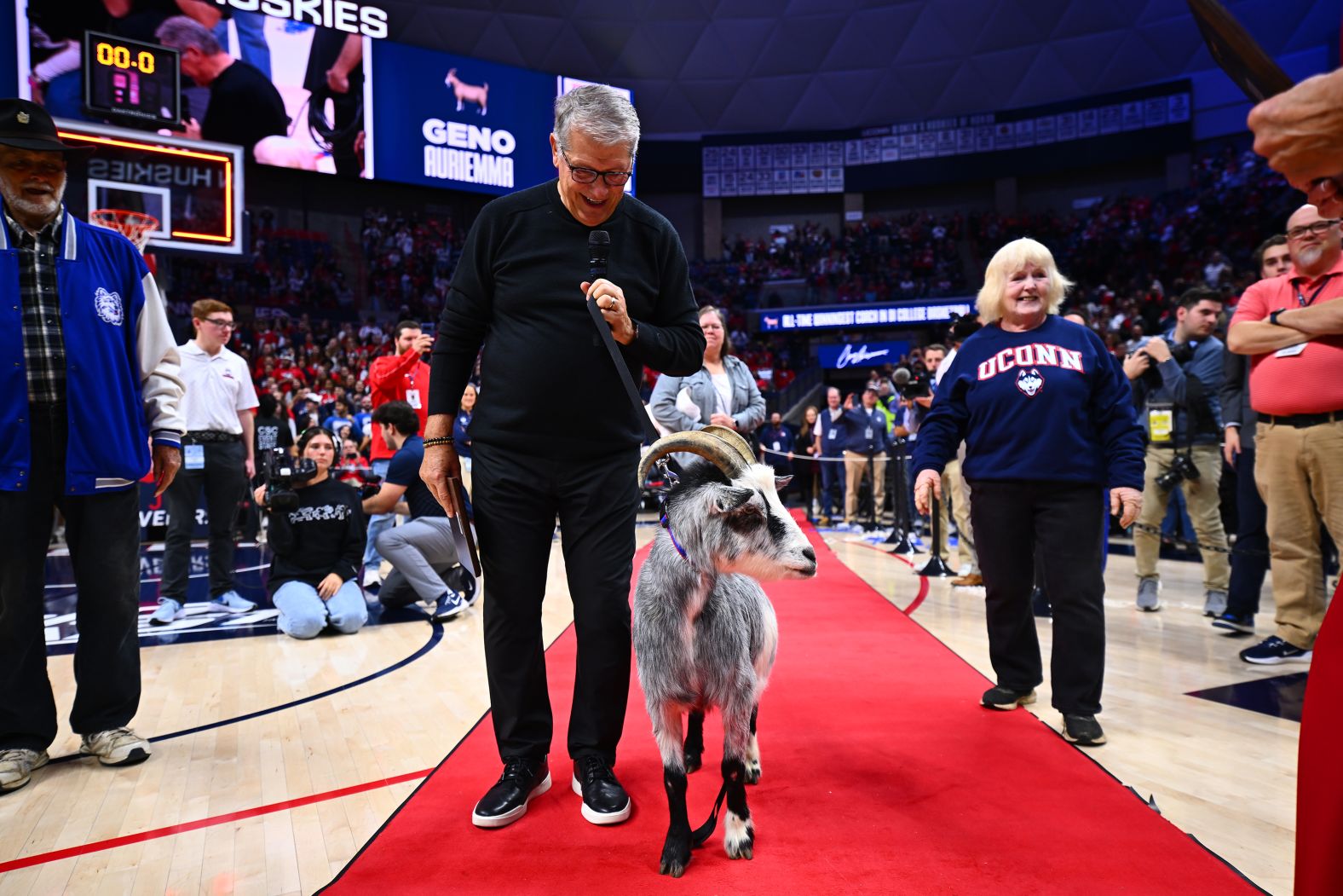 Geno Auriemma, the head coach of the University of Connecticut’s women’s basketball team, walks a red carpet with a goat after he became <a href="index.php?page=&url=https%3A%2F%2Fwww.cnn.com%2F2024%2F11%2F20%2Fsport%2Fuconn-geno-auriemma-ncaa-wins-record-spt-intl%2Findex.html">college basketball’s all-time winningest coach</a> on Wednesday, November 20.