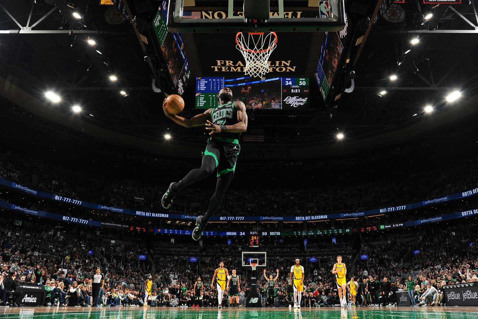 Boston Celtics guard Jaylen Brown dunks the ball during an NBA game against the Indiana Pacers on Friday, December 27.