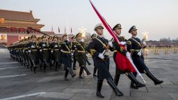 BEIJING, CHINA - JANUARY 01: The Guard of Honor of the Chinese People's Liberation Army (PLA) escorts the Chinese national flag to Tian'anmen Square during a flag-raising ceremony on New Year's Day on January 1, 2024 in Beijing, China. (Photo by VCG/VCG via Getty Images)