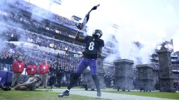 Baltimore Ravens quarterback Lamar Jackson (8) is introduced before an NFL football game against the Miami Dolphins in Baltimore, Sunday, Dec. 31, 2023. (AP Photo/Nick Wass)