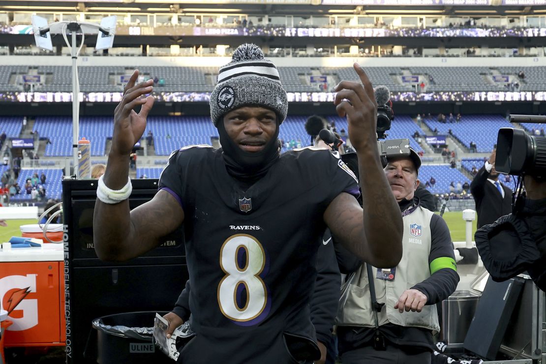 BALTIMORE, MARYLAND - DECEMBER 31: Quarterback Lamar Jackson #8 of the Baltimore Ravens celebrates walking off the field after the Ravens defeated the Miami Dolphins at M&T Bank Stadium on December 31, 2023 in Baltimore, Maryland. (Photo by Rob Carr/Getty Images)