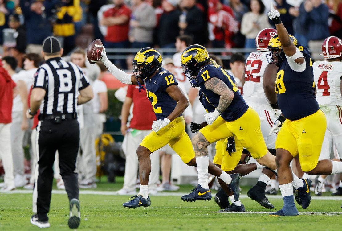 PASADENA, CALIFORNIA - JANUARY 01: Josh Wallace #12 of the Michigan Wolverines celebrates after recovering a fumble in the fourth quarter against the Alabama Crimson Tide during the CFP Semifinal Rose Bowl Game at Rose Bowl Stadium on January 01, 2024 in Pasadena, California. (Photo by Kevork Djansezian/Getty Images)